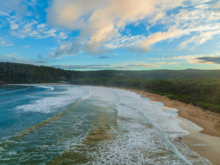 Aerial sunset at the seaside with rain clouds