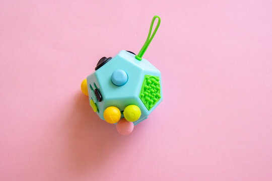 Colorful anti stress sensory toy. Creative and funny concepts of children toys. Popular toy. Bright background, top view.