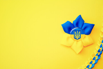 Ukraine flag symbol background. Ukrainian flower trident symbol isolated on yellow banner. Support...
