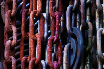 Rusty metal chains. Various shades of red.