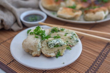 Shanghai pan fried pork dumpling with wild garlic