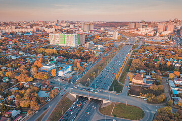 Fototapeta na wymiar City crossroads and overpasses with traffic aerial view. Transport in the busy city concept