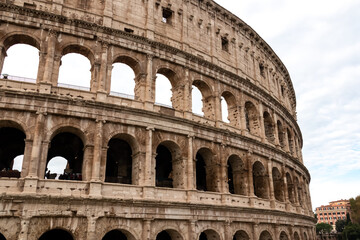 Panoramic view on exterior facade of famous Colosseum (Coloseo) of city of Rome, Lazio, Italy, Europe. UNESCO World Heritage Site. Flavian Amphitheater of ancient Roman Empire. Concept tourism