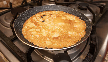 Pancakes from liquid dough are fried