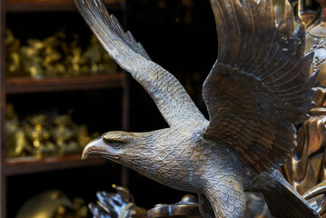 A metal eagle statue for sale in the market