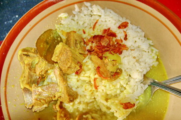 Goat curry with rice in plate