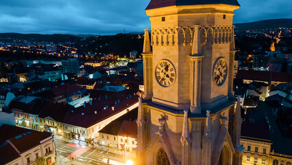 Aerial drone view of Saint Michael Church in Cluj at evening, Romania