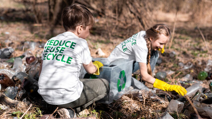 Boy and girl at plastic garbage collection