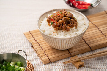Taiwanese fried minced pork with pickled cucumber on rice named GUA ZI ROU FAN.