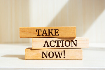 Wooden blocks with words 'Take action now!'. Business concept.