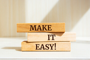 Wooden blocks with words 'Make it easy!'.