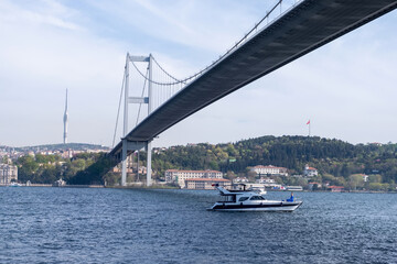 Naklejka premium Landscape of the one side of the Bosphorus and a boat passing by