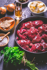 Raw chicken liver with cooking ingredients for liver pate