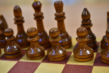 Chessboard with wooden pieces black and white