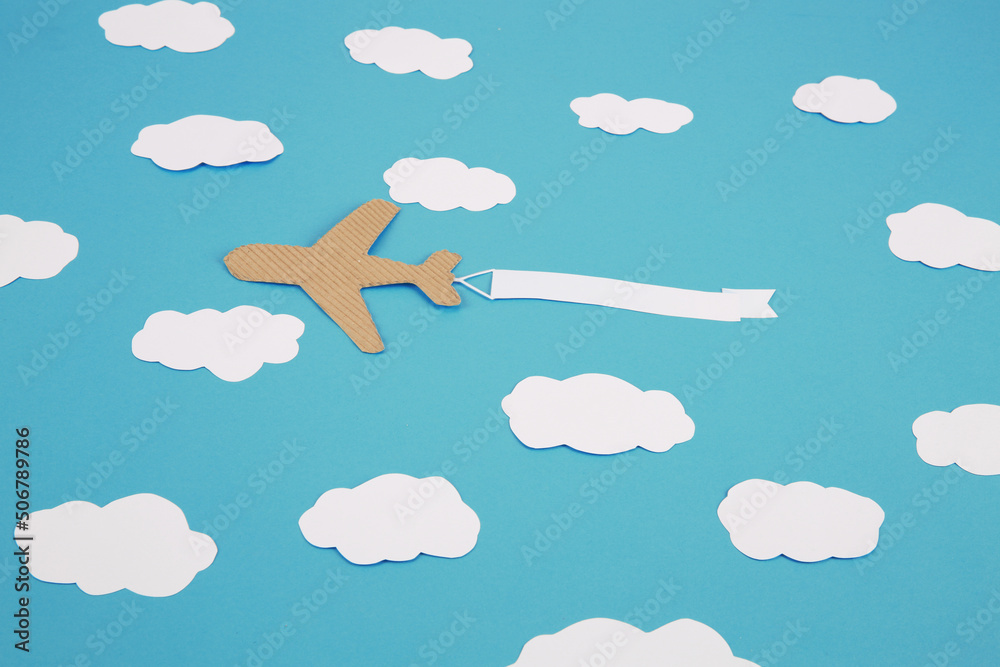 Wall mural craft airplane on blue ground above the clouds