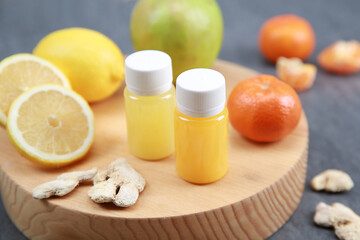 apple and lemon, vitamin c in bottle