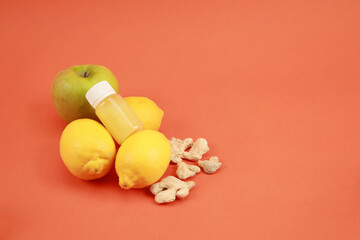 apple and lemon, vitamin c in bottle