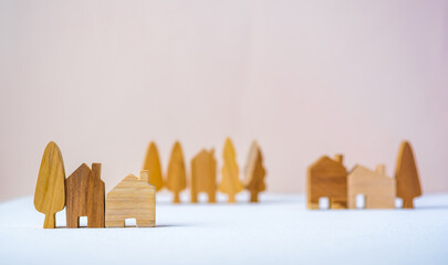 group of wood home toy shape on white table peach background