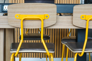 Yellow decorative chairs in restaurant.