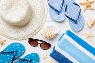 Summer vacation concept flat lay. beach accessories and towel top view. Space for text. travel...