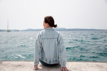 woman back relaxing at seascape in summer