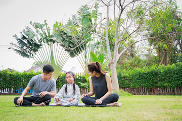 Family outdoors. Parent with child spends time together. exercise at home concept and new normal.