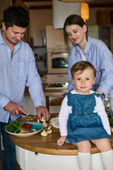 dad mom and their daughter cook pizza together in the kitchen. The concept of a happy family