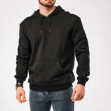 man wears black hoodie. isolated clothing mockup photo