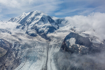 Panorama of stunning mountains and glaciers above, Switzerland.