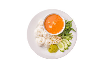 Above view of Thai rice noodle with fish curry sauce and vegetables in plate isolated on white background. Kanom Jeen Nam Ya of Asian meal traditional style. Popular Thai food. Thai food menu. Top-dow