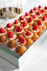 Mini Strawberry Fruit appetizing Tarts. Pastry cupcake dessert with strawberry fruits and cream