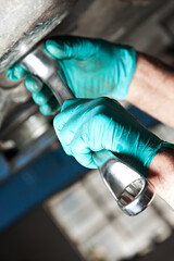 Mechanic car service auto garage in automotive mobile center. Technician workshop repair engine motor.