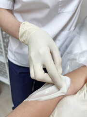 hand depilation. body hair removal paste. smooth skin. epilation with sugar wax. sugaring, beauty salon