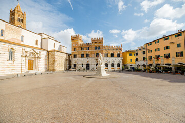 Morning view on Piazza Dante, central square in Grosseto town on sunny day. This city is the center of Maremma region at western central Italy - obrazy, fototapety, plakaty