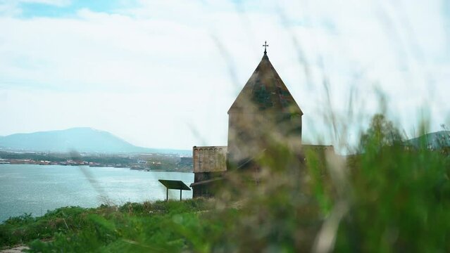 Sevanavank Monastery by Sevan Lake in Armenia and green grass . High quality 4k footage