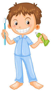Boy in pyjamas holding toothbrush and toothpaste