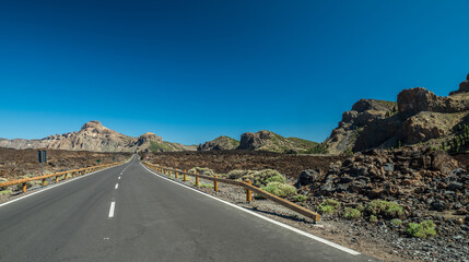  Empty asphalt road in Teide National Park. Tenerife Island.