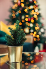 Decorative Christmas tree on the background of garland lights.