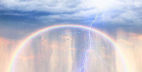 Amazing lightning over the rain   with amazing rainbow at sunset