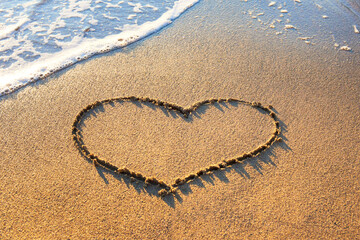 Heart drawing on sand