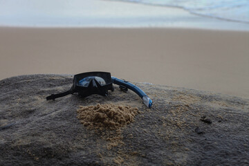 mask and snorkel on the beach lies. High quality photo