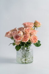 Glass vase and pink roses