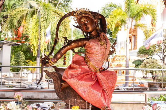 The Sculpture of the goddess of the earth twisting her hair or Thai name "Phra mae thorani beeb muay phom" at Wat Chomphuwek temple , Nonthaburi Province , Thailand