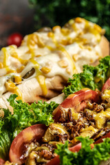 Hot dogs with different toppings on a dark background. Food background. fast food and junk food concept, Street food