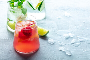 Summer cocktails. Cold drinks with fresh fruit. Healthy mocktails. Glasses of lemonade with ice, with copy space