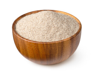 Raw rye flour in the wooden bowl, isolated on white background.