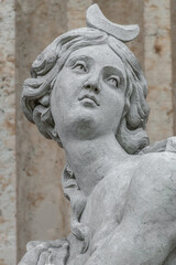 Cover page with an old statue of ancient sensual Renaissance Era woman in Potsdam, Germany, details, closeup.