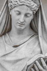 Cover page with an old statue of sensual Italian Renaissance Era woman reading a book, Potsdam, Germany, details, closeup.