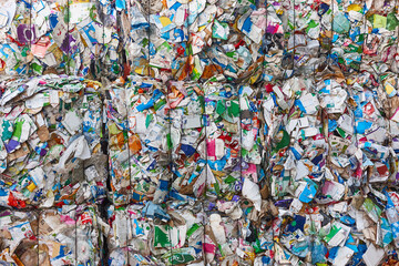 Fototapeta na wymiar Recycled and packaged waste. Sustainable industry. Reusable material