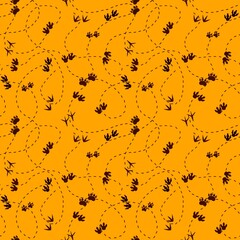 Animals footprints seamless dinosaur pattern for textiles and packaging and linens and gifts and wrapping paper and kids
